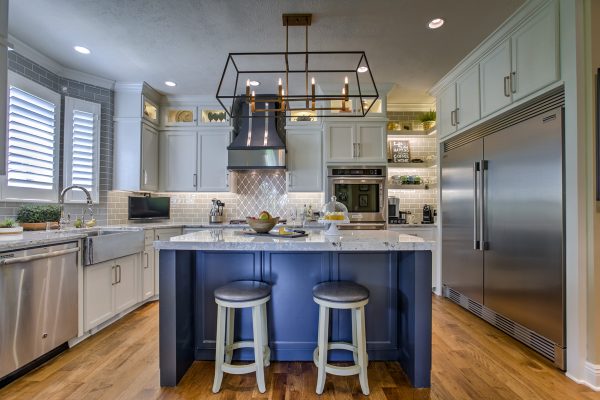 blue kitchen island with two stools 