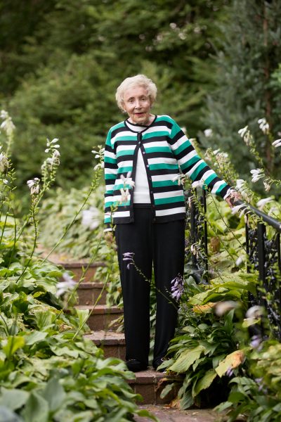 Marian Andersen standing on step in garden 