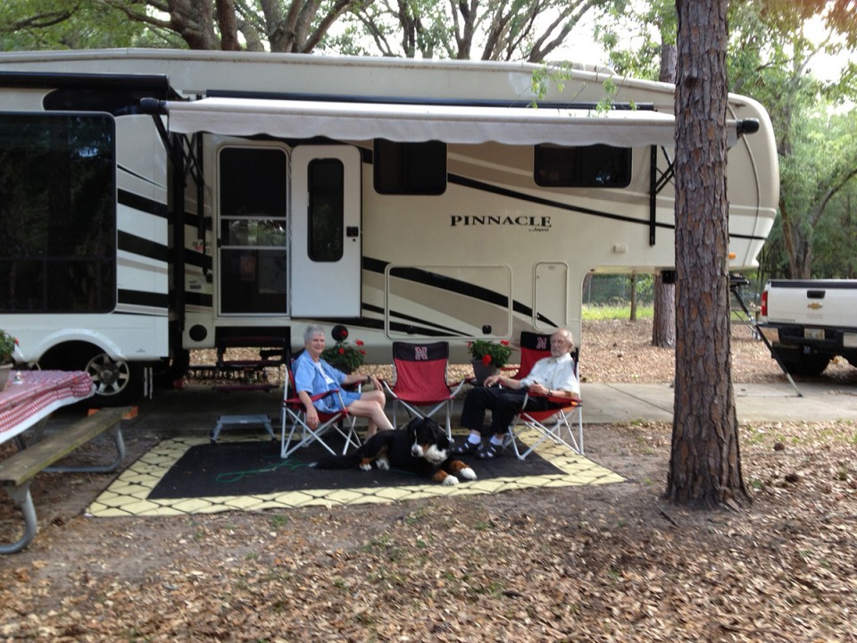Dr. Marvin and Joy Johnson with their travel companion, Barney, at a campsite in Orlando, Fla.